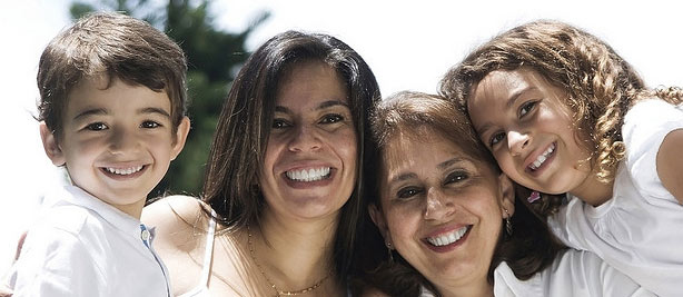 Grand Rapids family smiles and shows their good dental health after visiting a family dentist in Comstock Park.