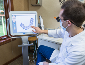 Dr Hull shows off the advanced dental technology available in Comstock Park, including digital x-rays, and dental lasers.