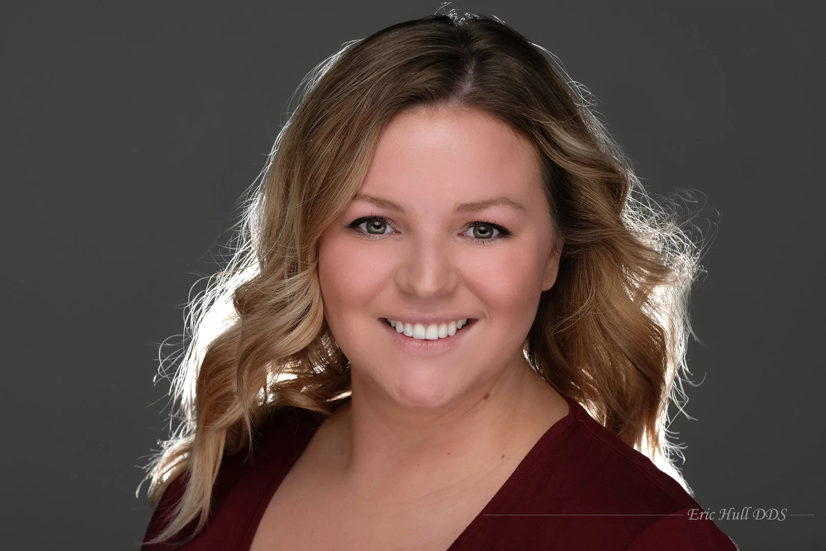 Patient shows off her teeth after getting cosmetic teeth bonding in Grand Rapids