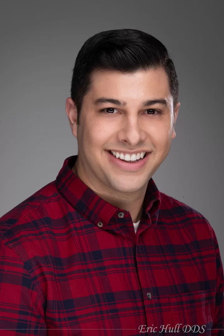 Patient shows off his two new teeth veneers near Rockford, MI.