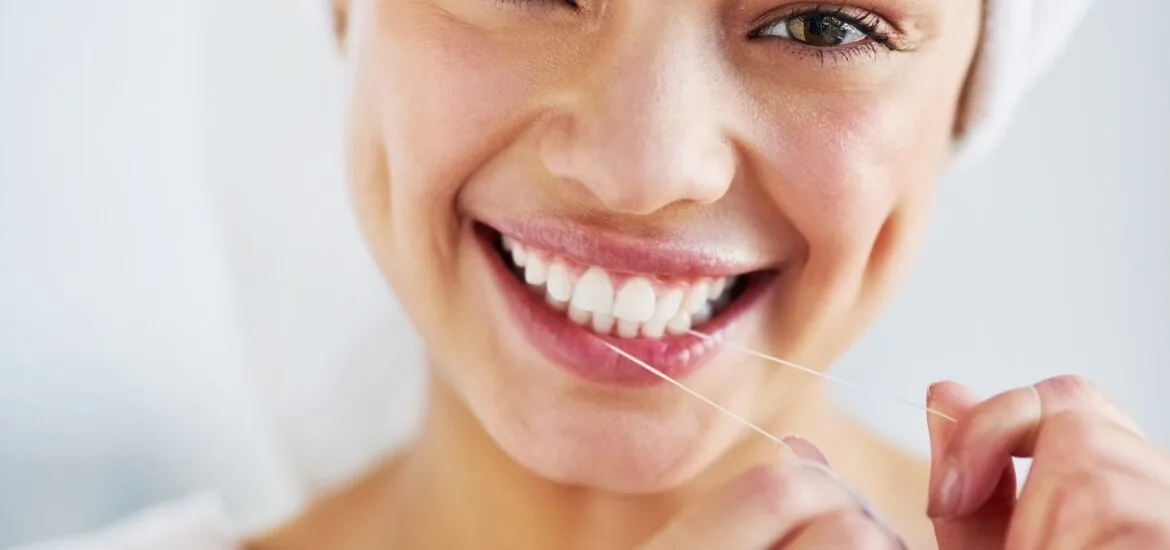 young woman showing her confident smile, white teeth