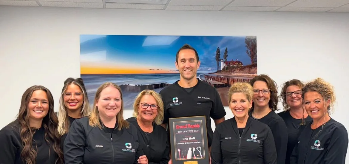 Dr. Eric Hull and his team celebrating their award for Grand Rapids top dentist 2025